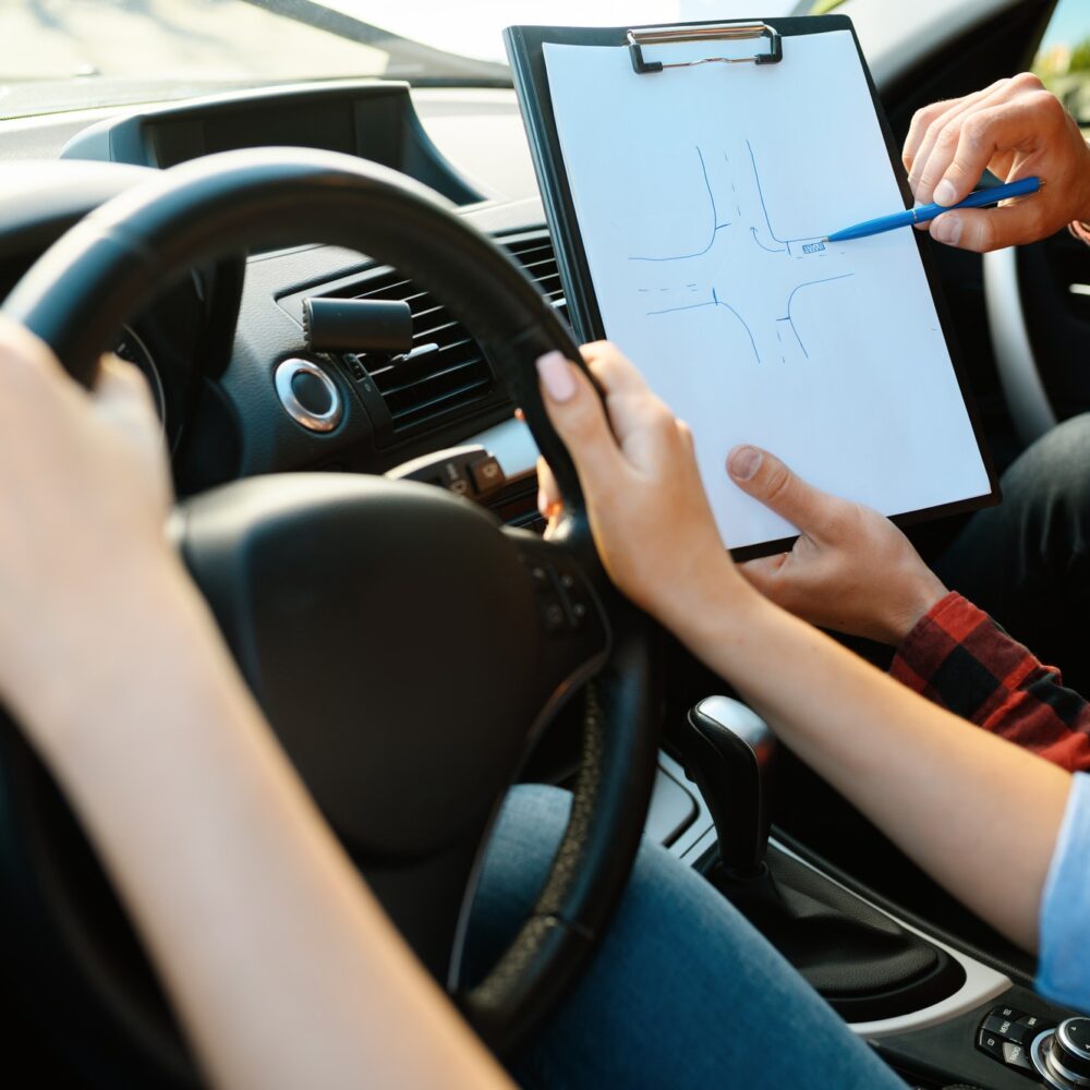 woman-and-man-with-checklist-driving-school.jpg